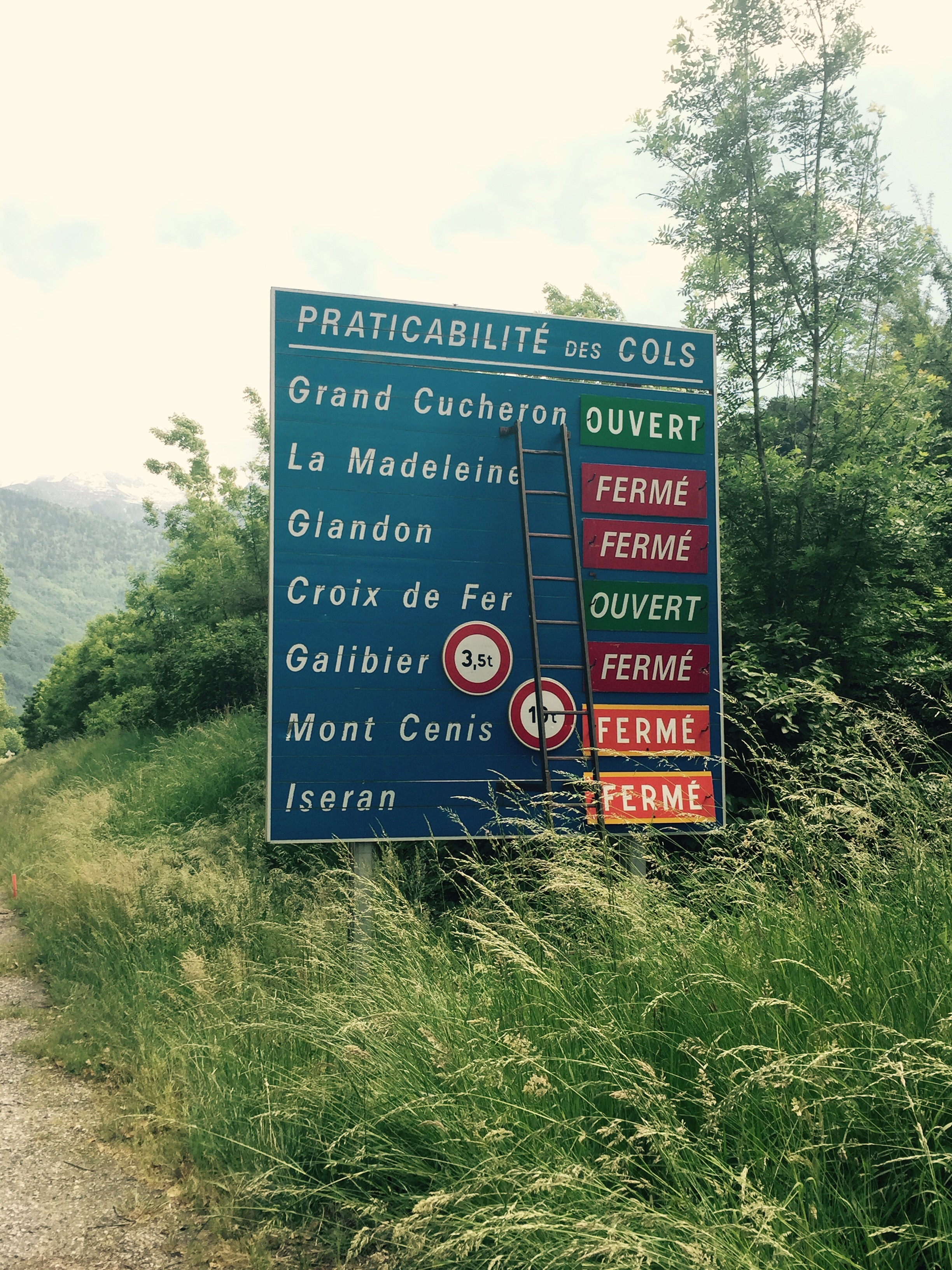 Road sign with state of local Alps passes