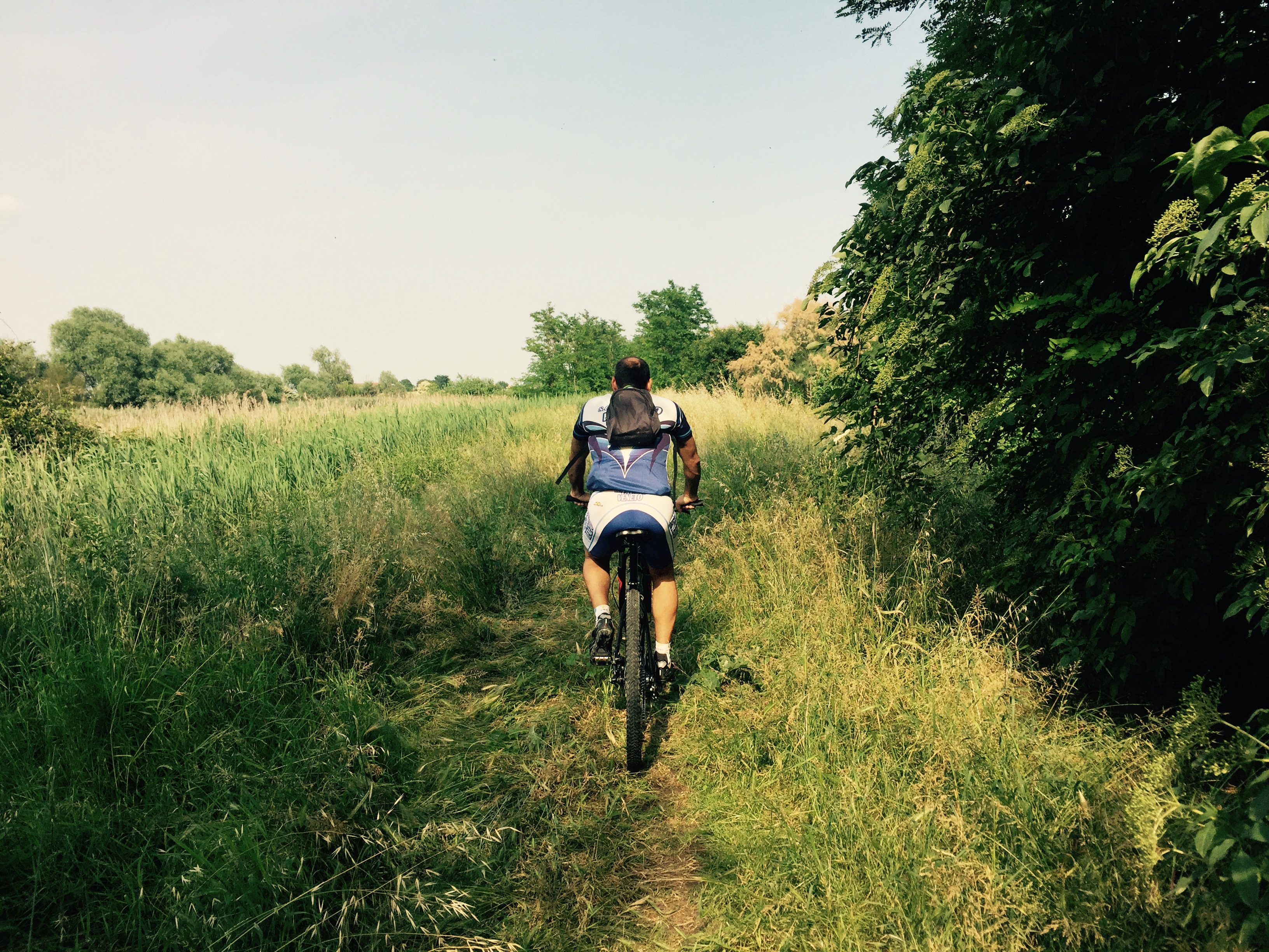 Bruno leads the grass path skirting Laguna Di Venezia