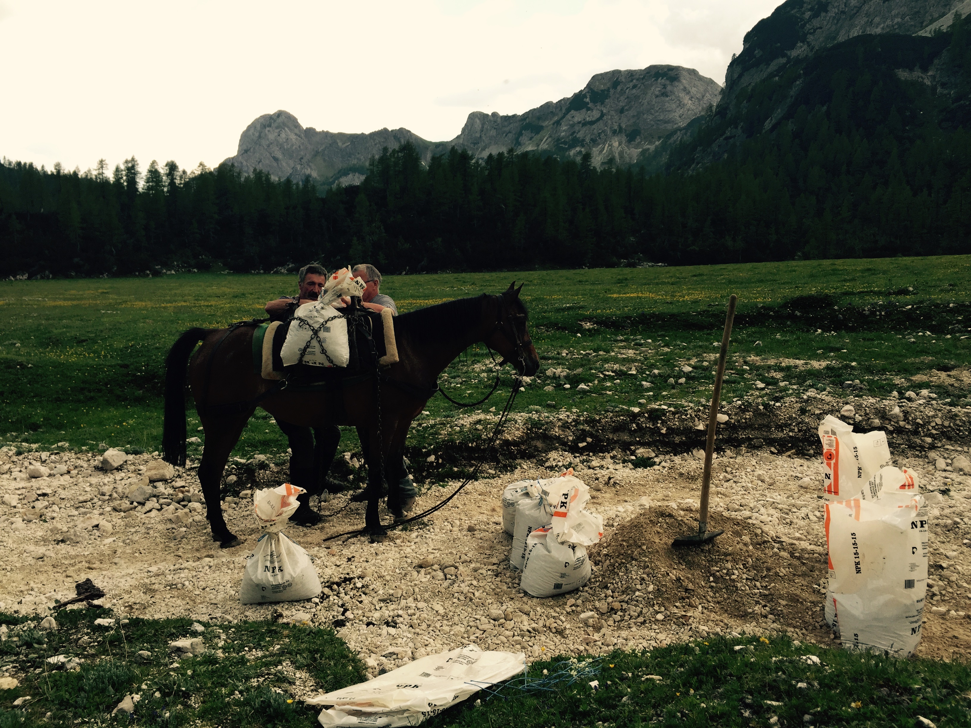 Filling sacks with gravel from the riverbed, Slovenia