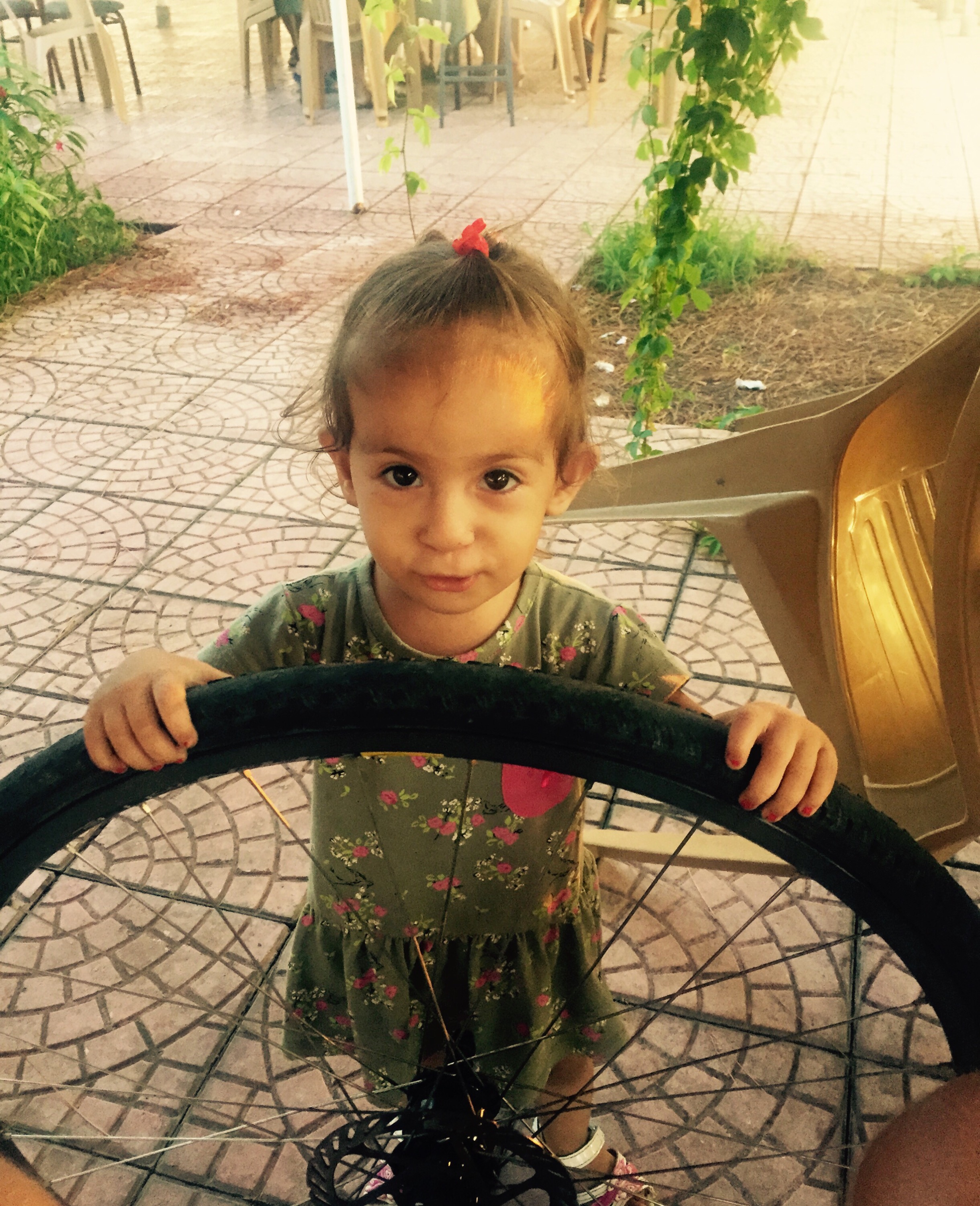 Girl helps with fixing a puncture, Turkey