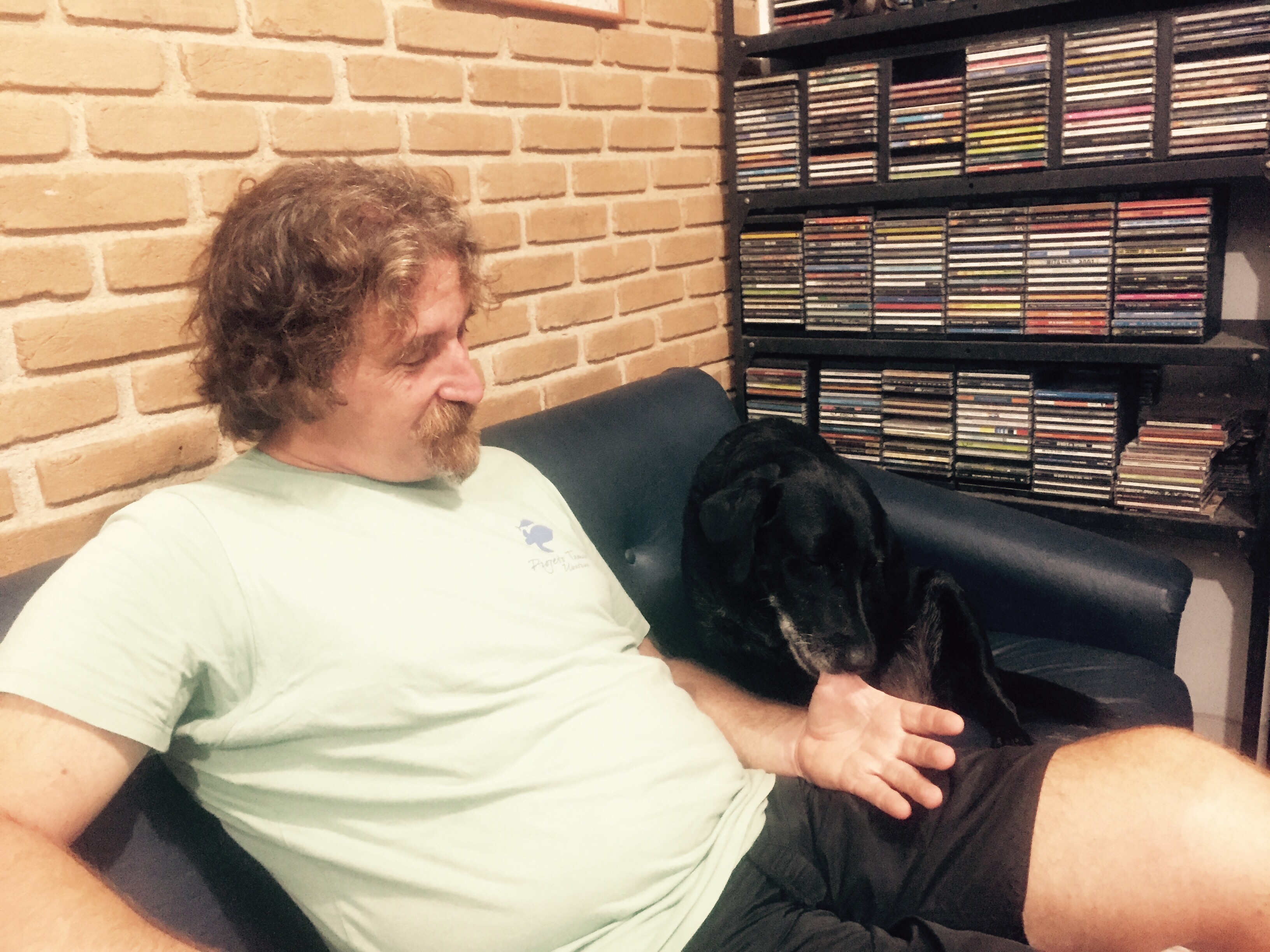 Henrique of Project TAMAR and his dog Noite, Ubatuba