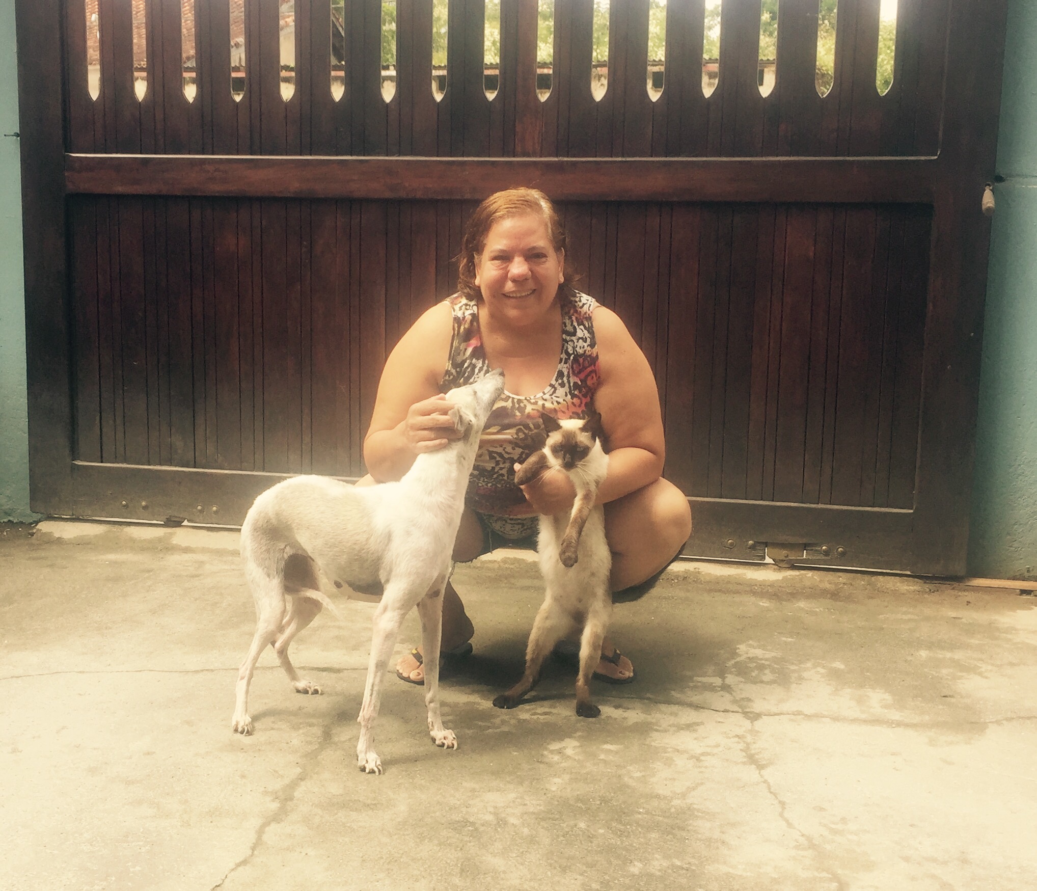 Generous host in Iguape with cat and dog, Brazil