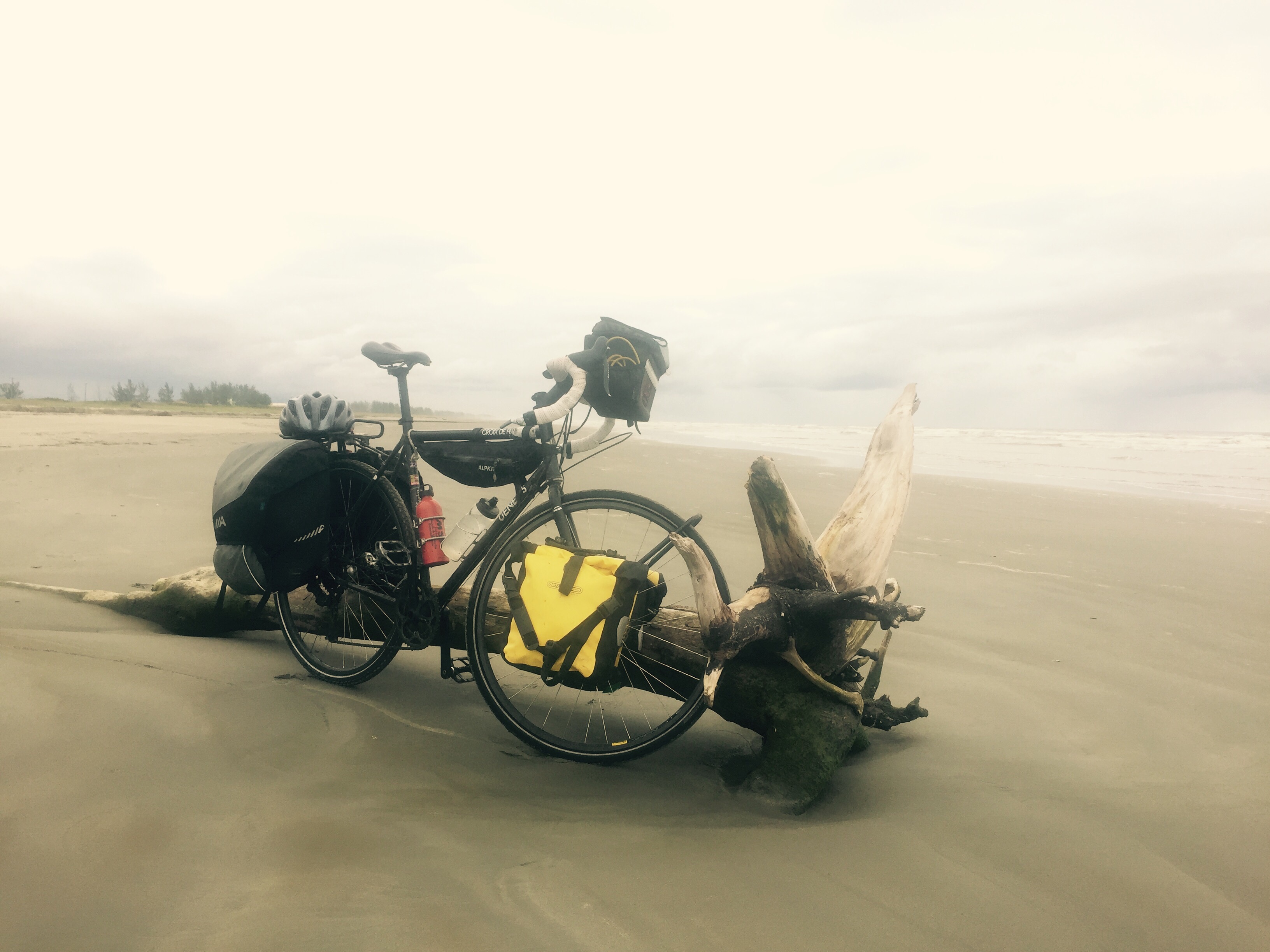 Touring bike on beach, Ilha Comprida, Brazil