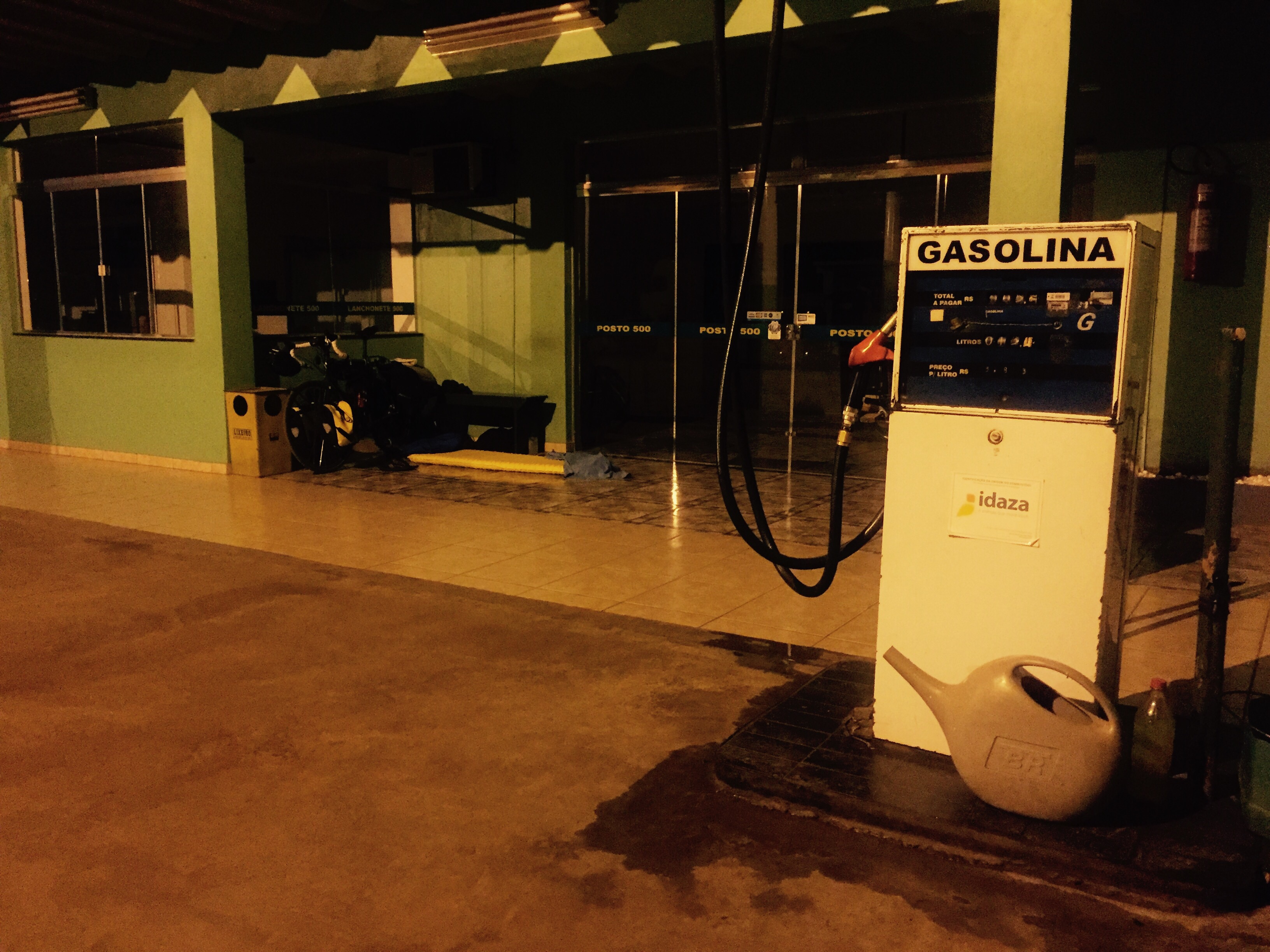 Sleeping on petrol station forecourt, Paraná, Brazil